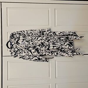 Ladies dress with asymmetrical hem and button neck detail